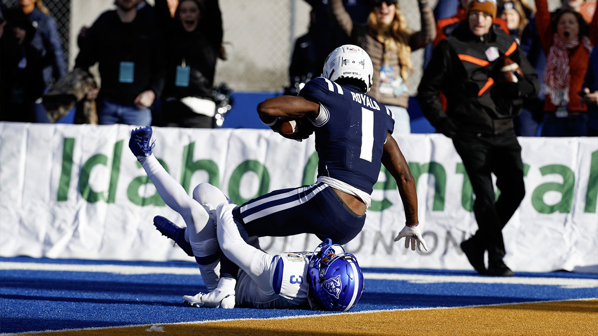 Utah State Aggies wide receiver Jalen Royals (1) scores a touchdown during the first half against the Georgia State Panthers at Albertsons Stadium.