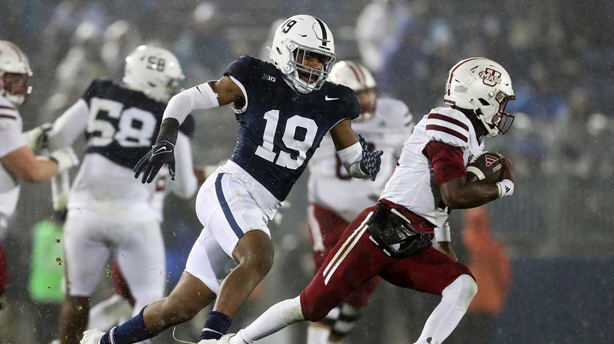 Penn State Nittany Lions defensive end Jameial Lyons (19) pressures Massachusetts Minutemen quarterback Ahmad Haston (16) during the fourth quarter at Beaver Stadium. Penn State defeated Massachusetts 63-0