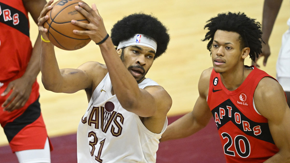 Cleveland Cavaliers center Jarrett Allen (31) jumps to Toronto Raptors guard Jeff Dowtin Jr. (20) during the third quarter at Rocket Mortgage FieldHouse.