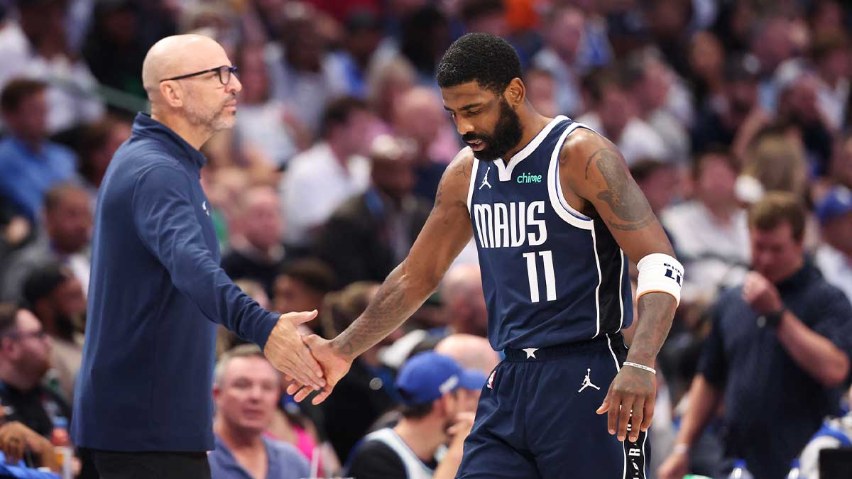 Dallas Mavericks head coach Jason Kidd high-fives guard Kyrie Irving (11) during the third quarter against the Minnesota Timberwolves in Game 4 of the Western Conference Finals of the 2024 NBA Playoffs at American Airlines Center.