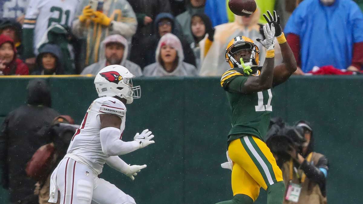 Green Bay Packers wide receiver Jayden Reed (11) catches a touchdown pass against the Arizona Cardinals on Sunday, October 13, 2024, at Lambeau Field in Green Bay, Wis. The Packers won the game, 34-13