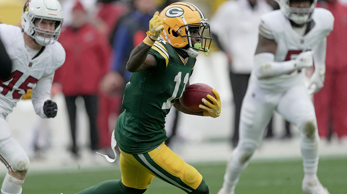 Green Bay Packers wide receiver Jayden Reed (11) returns a punt during the second quarter of their game