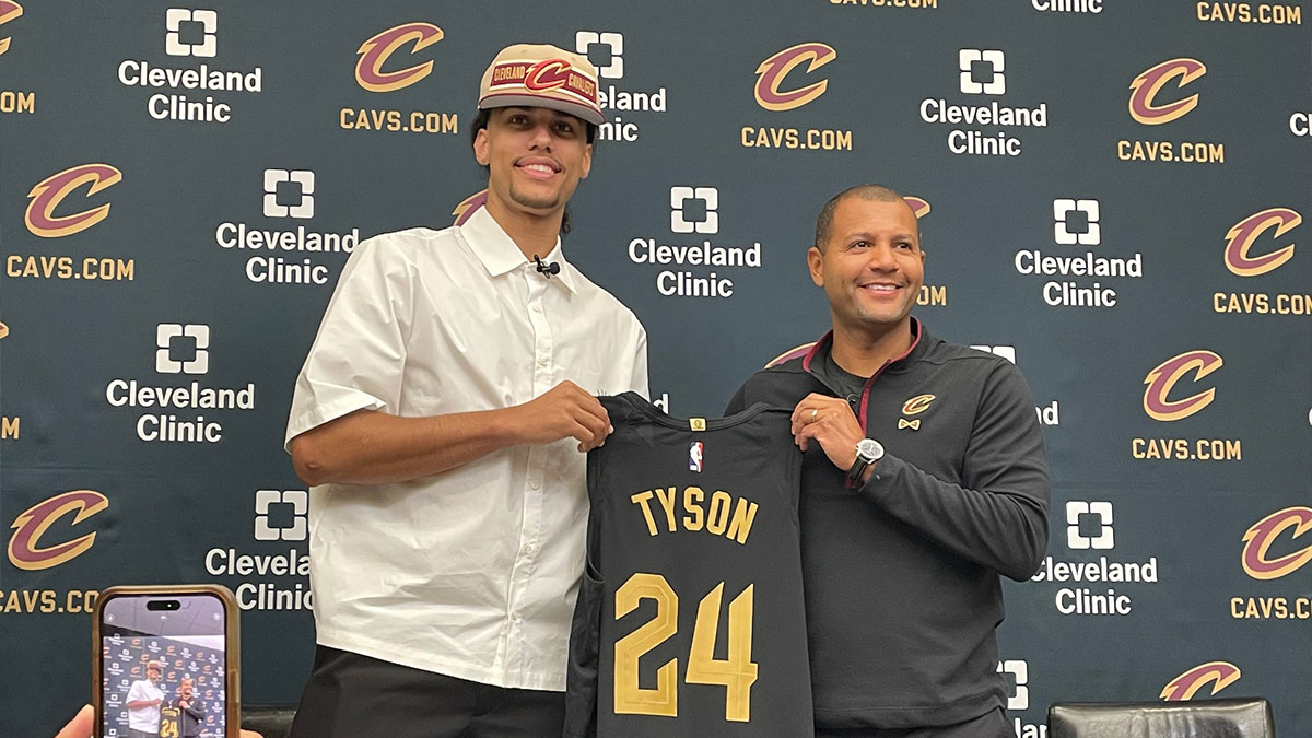Cavaliers first-round draft pick Jaylon Tyson and president of basketball operations Koby Altman hold a jersey during Tyson's introductory news conference Thursday, June 27, in Independence. The Cavs chose Tyson 20th overall.