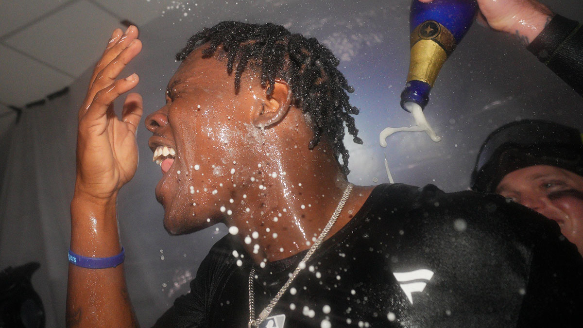 New York Yankees third baseman Jazz Chisholm Jr. (13) is sprayed with champagne as the New York Yankees celebrate a win over the Kansas City Royals during game four of the ALDS for the 2024 MLB Playoffs at Kauffman Stadium.