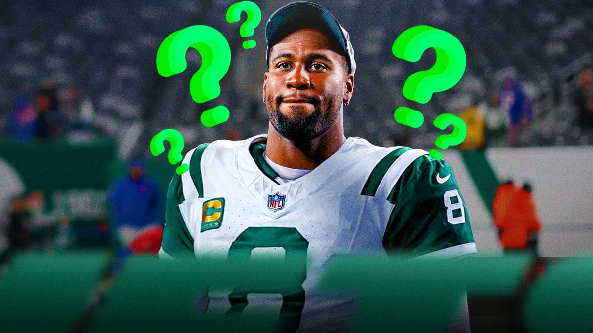 Haason Reddick in a New York Jets uniforms with little green question marks all around him as Reddick might play for the Jets in Week 8.