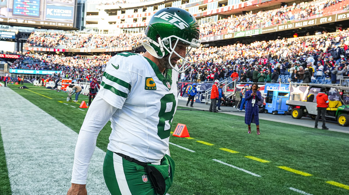 New York Jets quarterback Aaron Rodgers (8) exits the field after being defeated by the New England Patriots in the second half at Gillette Stadium.