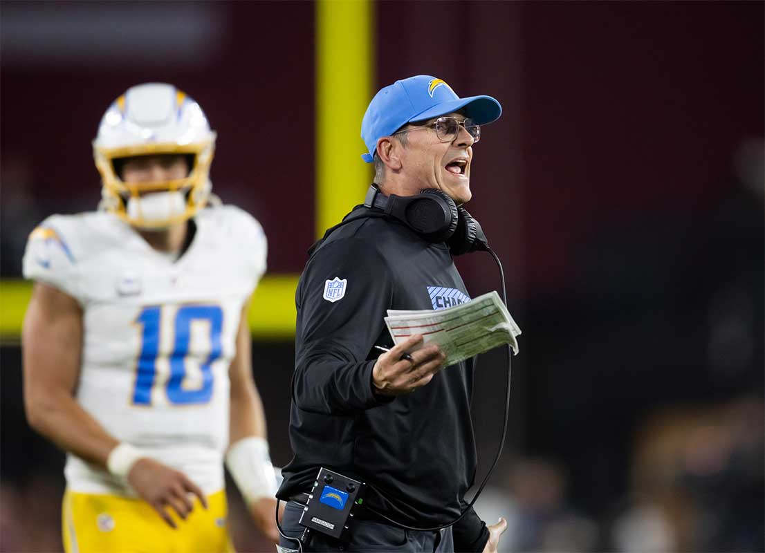 Los Angeles Chargers head coach Jim Harbaugh reacts against the Arizona Cardinals in the second half at State Farm Stadium.