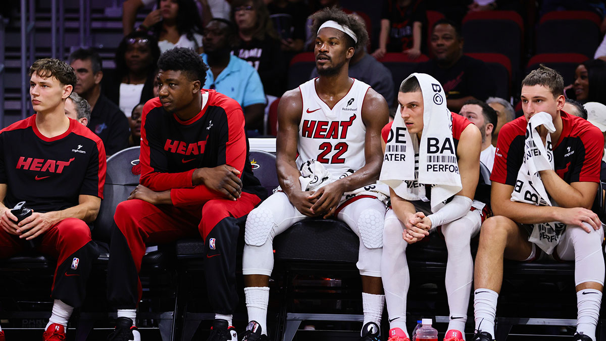 Miami Heat forward Jimmy Butler (22) watches from the bench against the New Orleans Pelicans during the second quarter at Kaseya Center.