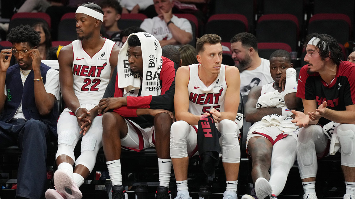 Miami Heat forward Jimmy Butler (22) and the Heat bench look on late in the game with the score out of reach to the Orlando Magic at Kaseya Center.