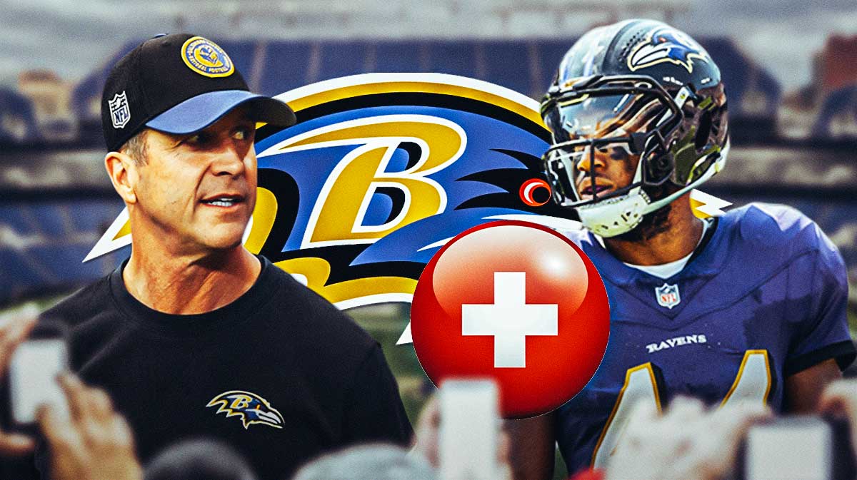 Ravens John Harbaugh looking at Marlon Humphrey next to a red cross