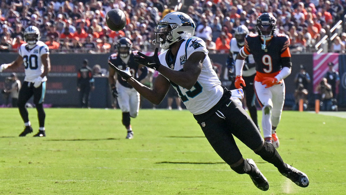 Carolina Panthers wide receiver Jonathan Mingo (15) makes a diving catch against the Chicago Bears during the third quarter at Soldier Field.
