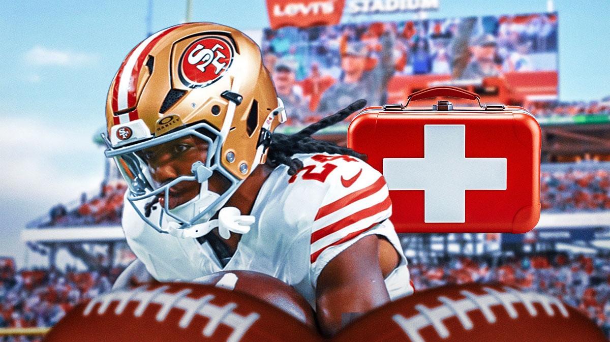 Jordan Mason in a 49ers jersey with first aid kits.
