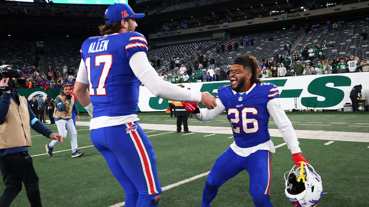Buffalo Bills quarterback Josh Allen (17) and Buffalo Bills running back Ty Johnson (26) celebrate the Buffalo Bills win over the New York Jets at MetLife Stadium.