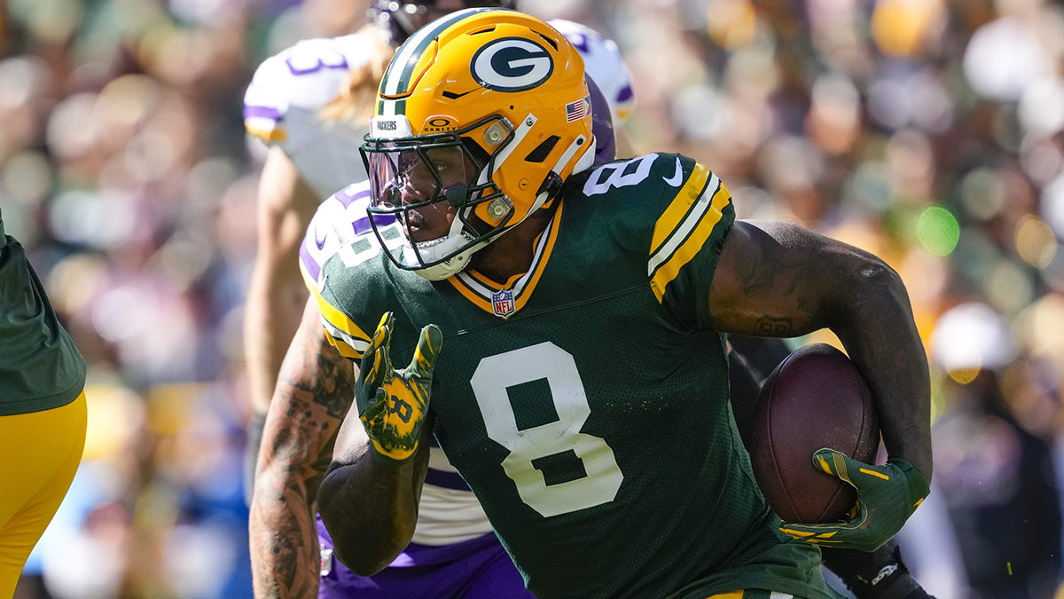 Green Bay Packers running back Josh Jacobs (8) rushes with the football during the first quarter against the Minnesota Vikings at Lambeau Field.