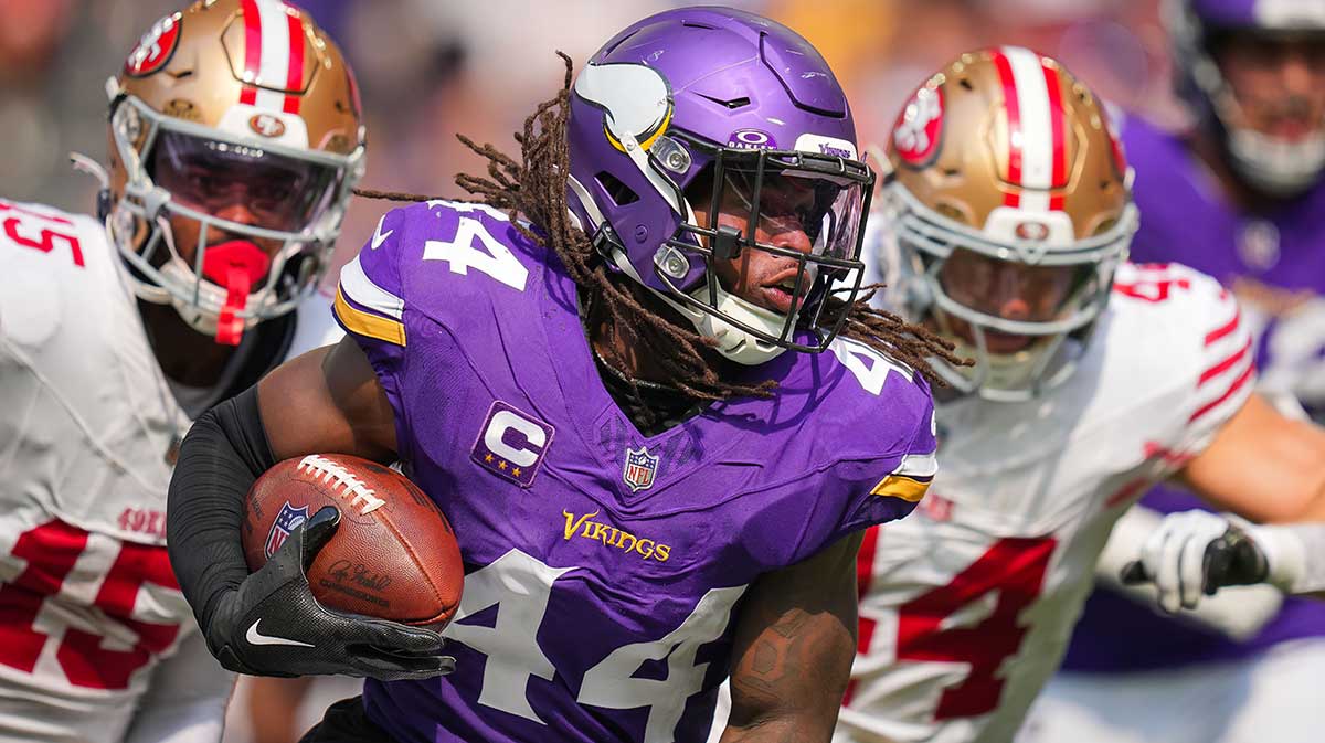 Minnesota Vikings safety Josh Metellus (44) intercepts the ball against the San Francisco 49ers in the third quarter at U.S. Bank Stadium.