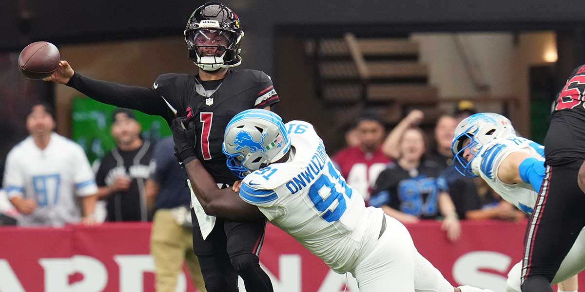 Arizona Cardinals quarterback Kyler Murray (1) releases the ball as he is dragged down by Detroit Lions defensive lineman Levi Onwuzurike (91) at State Farm Stadium in Glendale on Sept. 22, 2024.