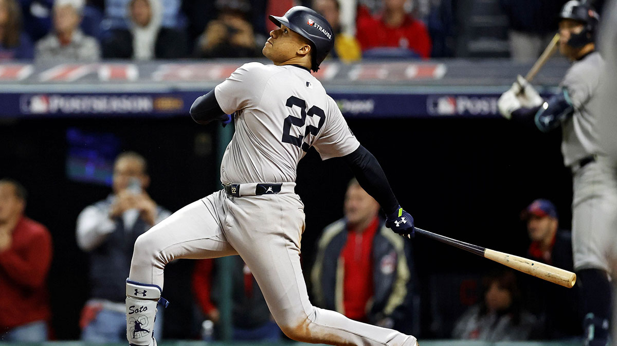 Oct 19, 2024; Cleveland, Ohio, USA; New York Yankees outfielder Juan Soto (22) hits a two run home run during the tenth inning against the Cleveland Guardians during game five of the ALCS for the 2024 MLB playoffs at Progressive Field. 