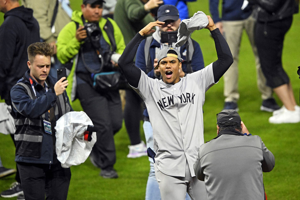 New York Yankees outfielder Juan Soto (22) celebrates after beating the Cleveland Guardians during game five of the ALCS for the 2024 MLB playoffs at Progressive Field.