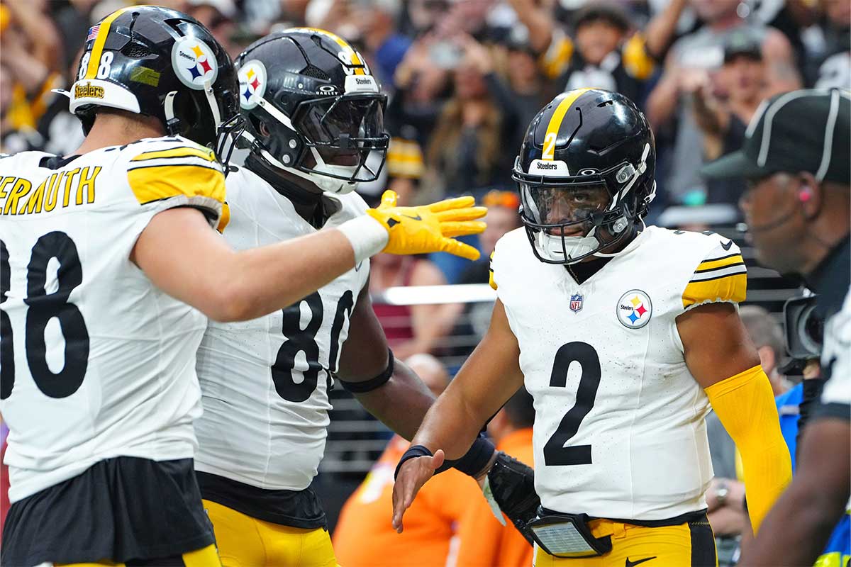 Pittsburgh Steelers quarterback Justin Fields (2) celebrates with team mates after scoring a rushing touchdown against the Las Vegas Raiders during the second quarter at Allegiant Stadium.