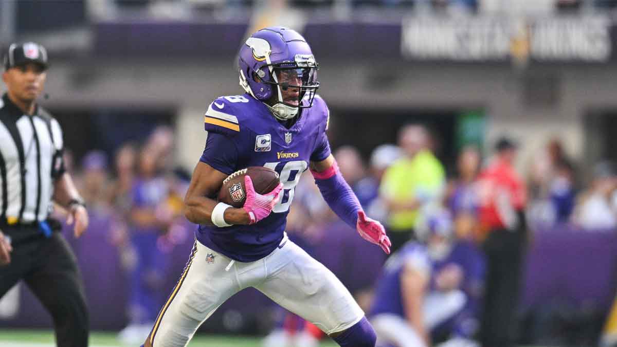 Minnesota Vikings wide receiver Justin Jefferson (18) runs the ball against the Detroit Lions during the fourth quarter at U.S. Bank Stadium