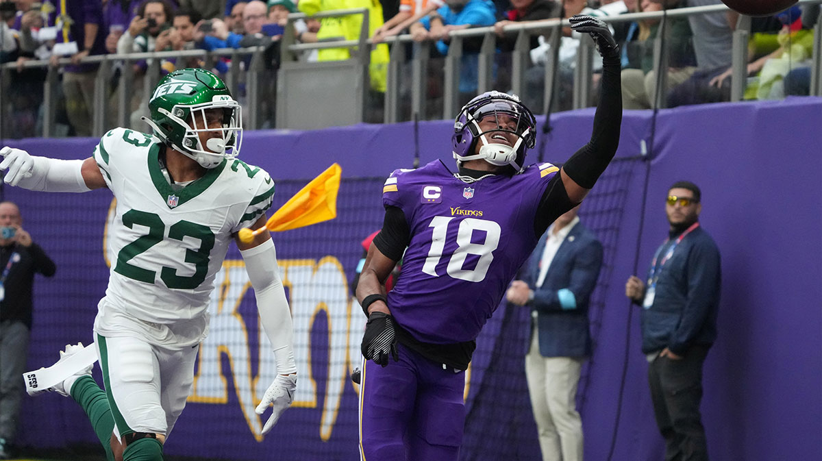Minnesota Vikings wide receiver Justin Jefferson (18) attempts to catch the ball against New York Jets cornerback Isaiah Oliver (23) in the first half at Tottenham Hotspur Stadium.
