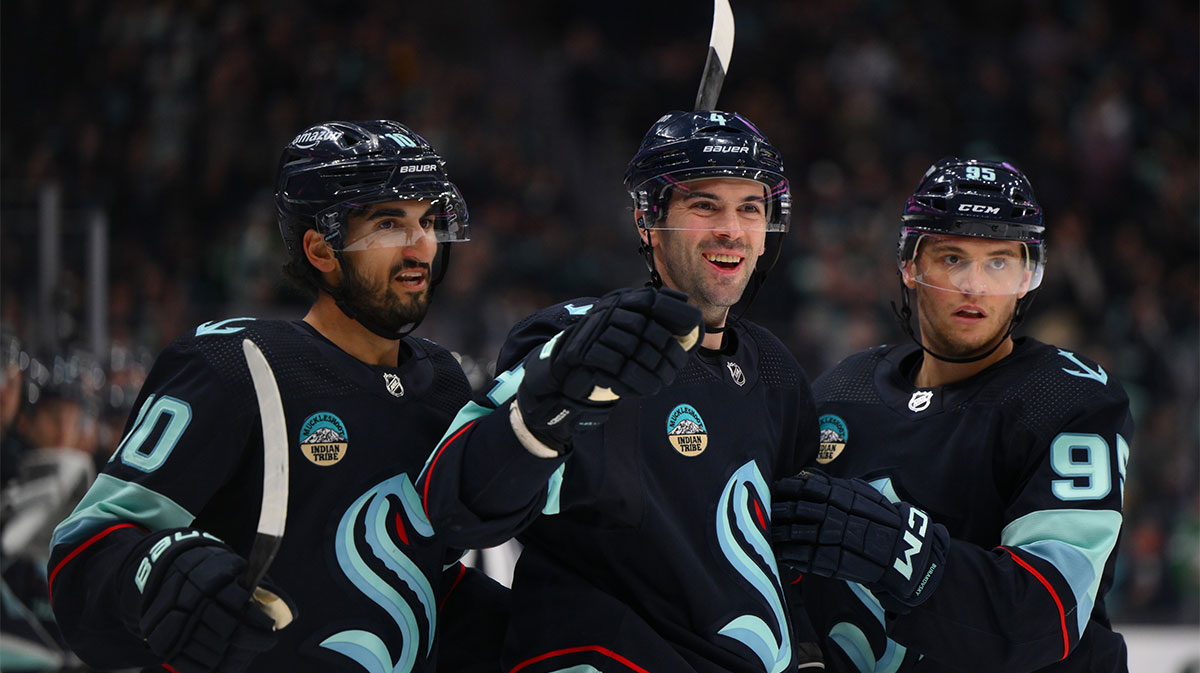 The Seattle Kraken celebrate after a goal scored by defenseman Justin Schultz (4) during the second period against the Arizona Coyotes at Climate Pledge Arena.