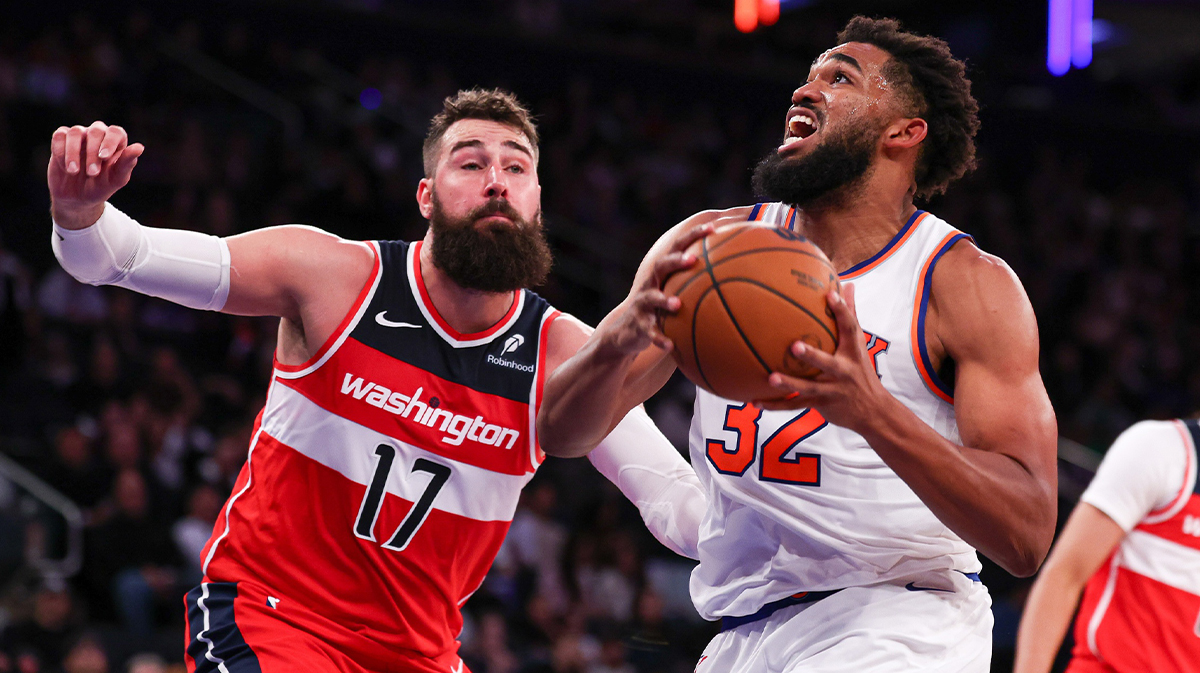 Knicks center Karl-Anthony Towns (32) drives to the basket against Washington Wizards center Jonas Valanciunas (17) during the second half at Madison Square Garden. 