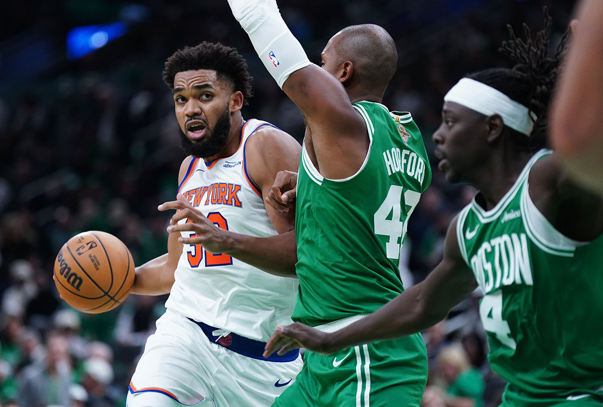 New York Knicks center Karl-Anthony Towns (32) drives the ball against Boston Celtics center Al Horford (42) in the second half at TD Garden. Knicks 2024-25 season