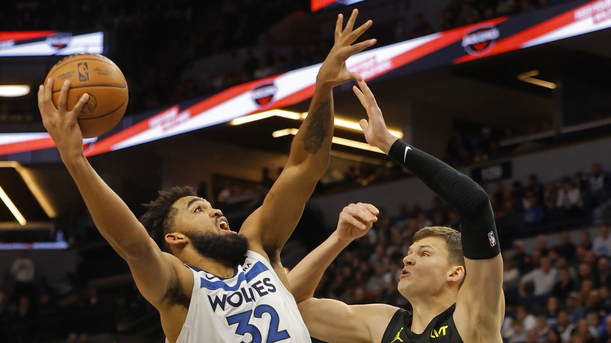 Minnesota Timberwolves forward Karl-Anthony Towns (32) shoots against Utah Jazz center Walker Kessler (24) in the first quarter at Target Center. 