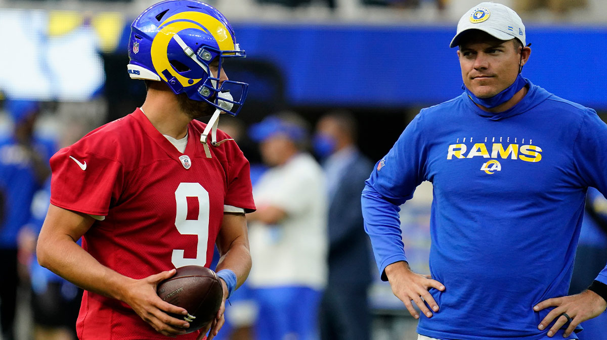Los Angeles Rams quarterback Matthew Stafford (9) talks to offensive coordinator Kevin O'Connell during an offseason workout at SoFi Stadium.