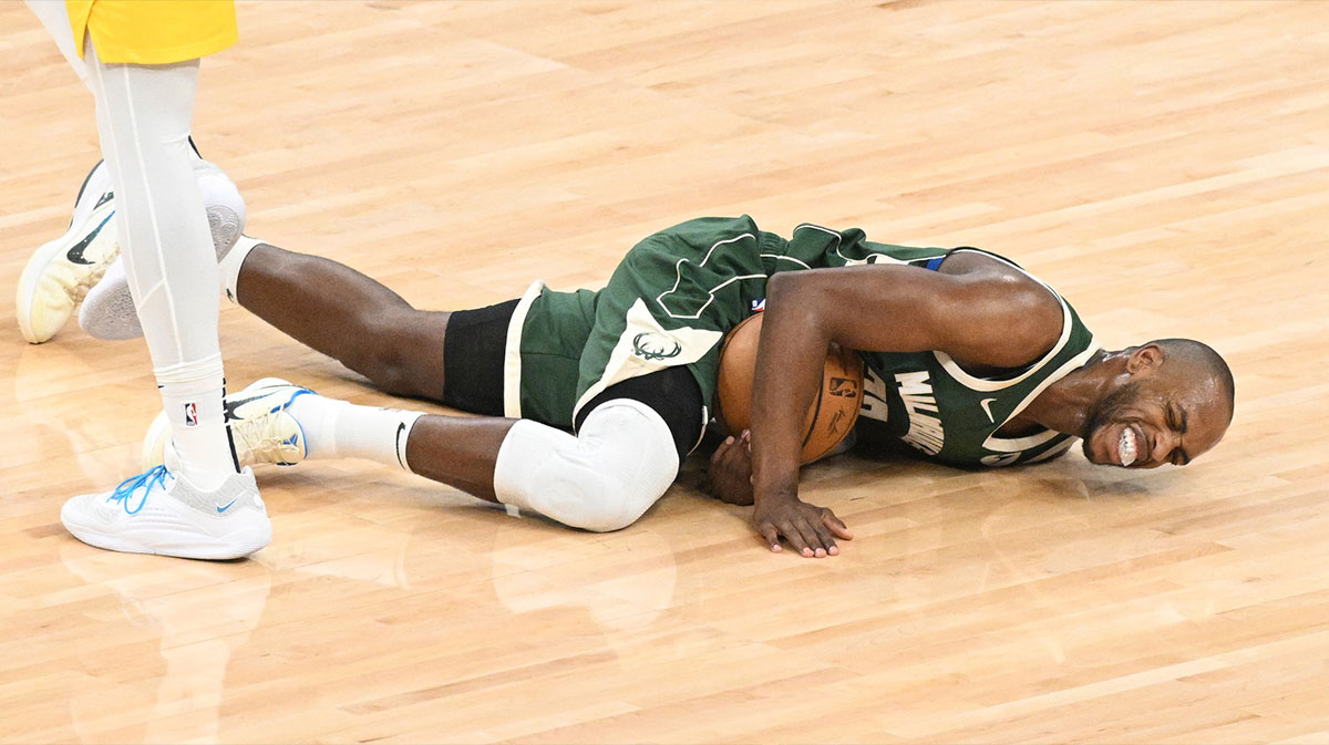 Milwaukee Bucks forward Khris Middleton (22) reacts after an injury against the Indiana Pacers in the first half during game two of the first round for the 2024 NBA playoffs at Fiserv Forum.