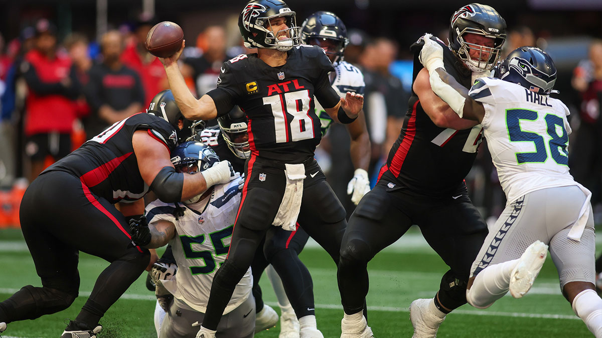 Atlanta Falcons quarterback Kirk Cousins (18) throws a pass against the Seattle Seahawks in the fourth quarter at Mercedes-Benz Stadium.