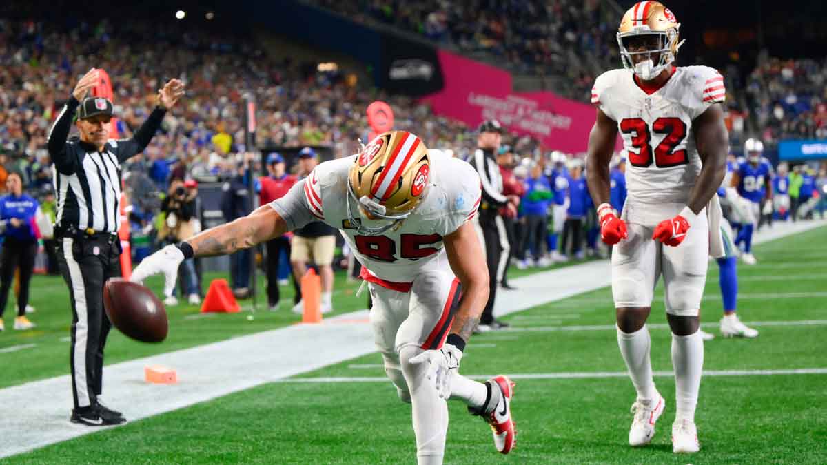 San Francisco 49ers tight end George Kittle (85) spikes the ball after scoring a touchdown against the Seattle Seahawks during the second half at Lumen Field. 