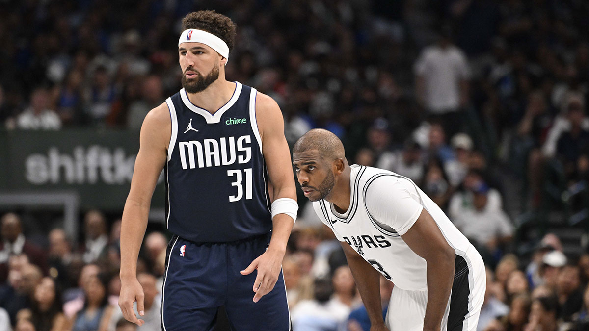 Dallas Mavericks guard Klay Thompson (31) and San Antonio Spurs guard Chris Paul (3) look on during the second half at the American Airlines Center.