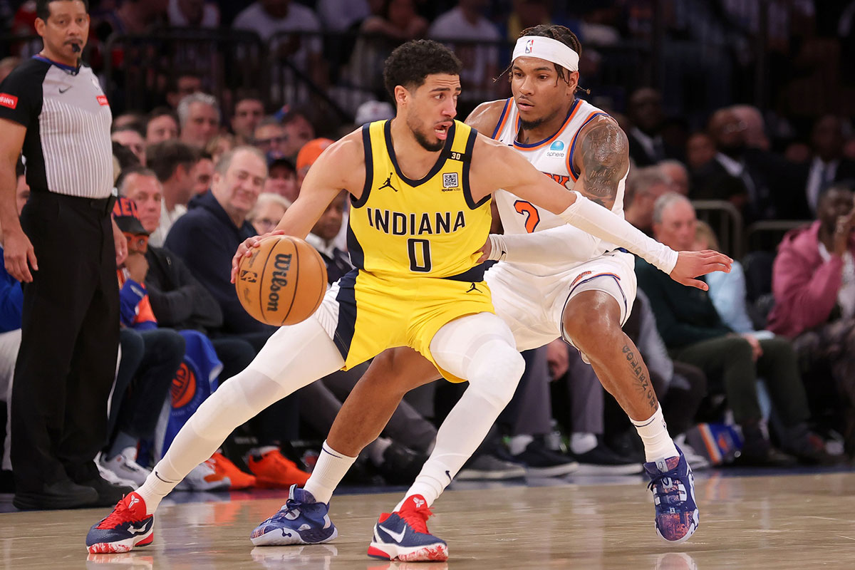Indiana Pacers guard Tyrese Haliburton (0) controls the ball against New York Knicks guard Miles McBride (2) during the fourth quarter of game seven of the second round of the 2024 NBA playoffs at Madison Square Garden. 