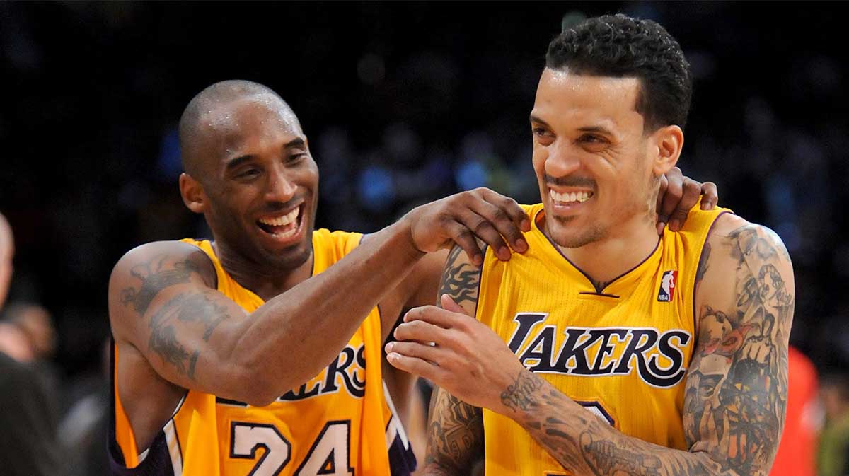 Los Angeles Lakers shooting guard Kobe Bryant (24) laughs with small forward Matt Barnes (9) at the end of the game against the Portland Trail Blazers at the Staples Center. Lakers won 103-96.