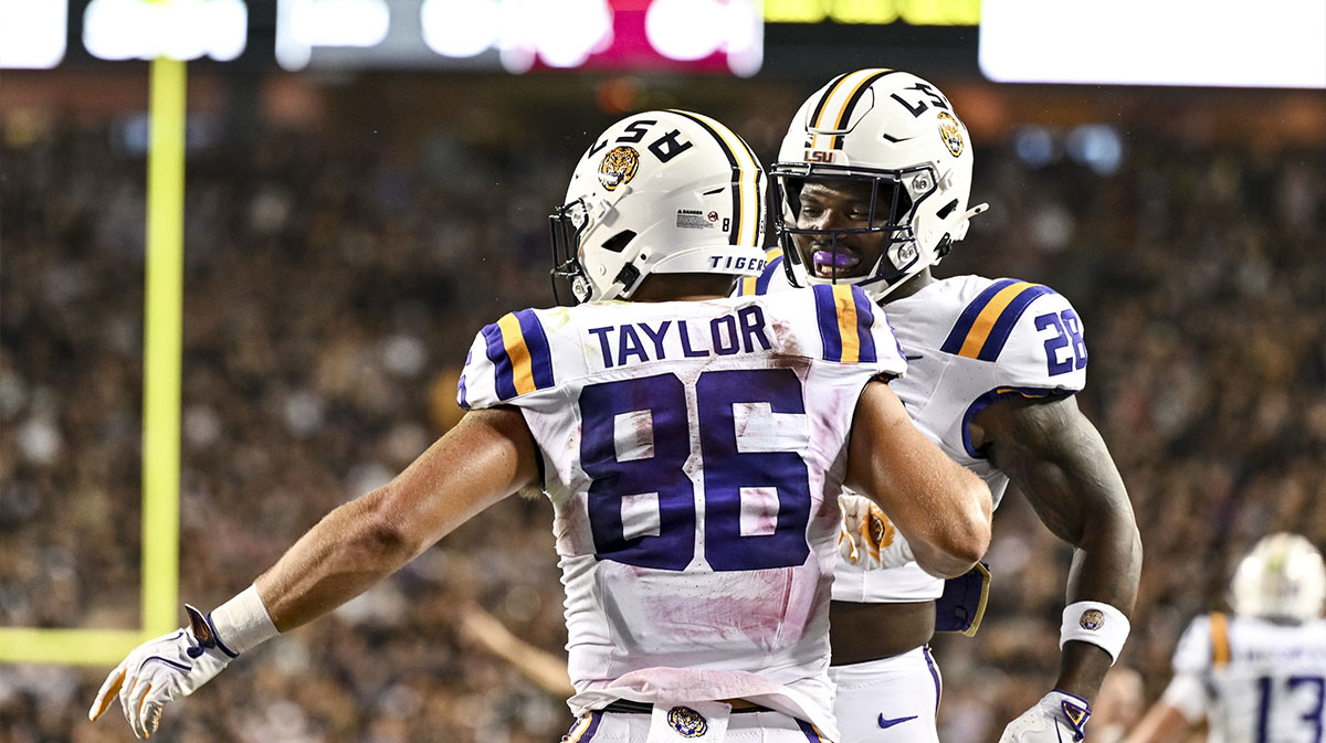 LSU Tigers tight end Mason Taylor (86) celebrates with running back Kaleb Jackson (28) during the first quarter against the Texas A&M Aggies at Kyle Field.