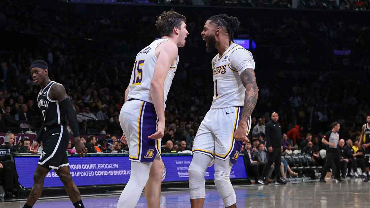 Los Angeles Lakers guard Austin Reaves (15) and guard D'Angelo Russell (1) react after a basket during the second half against the Brooklyn Nets at Barclays Center