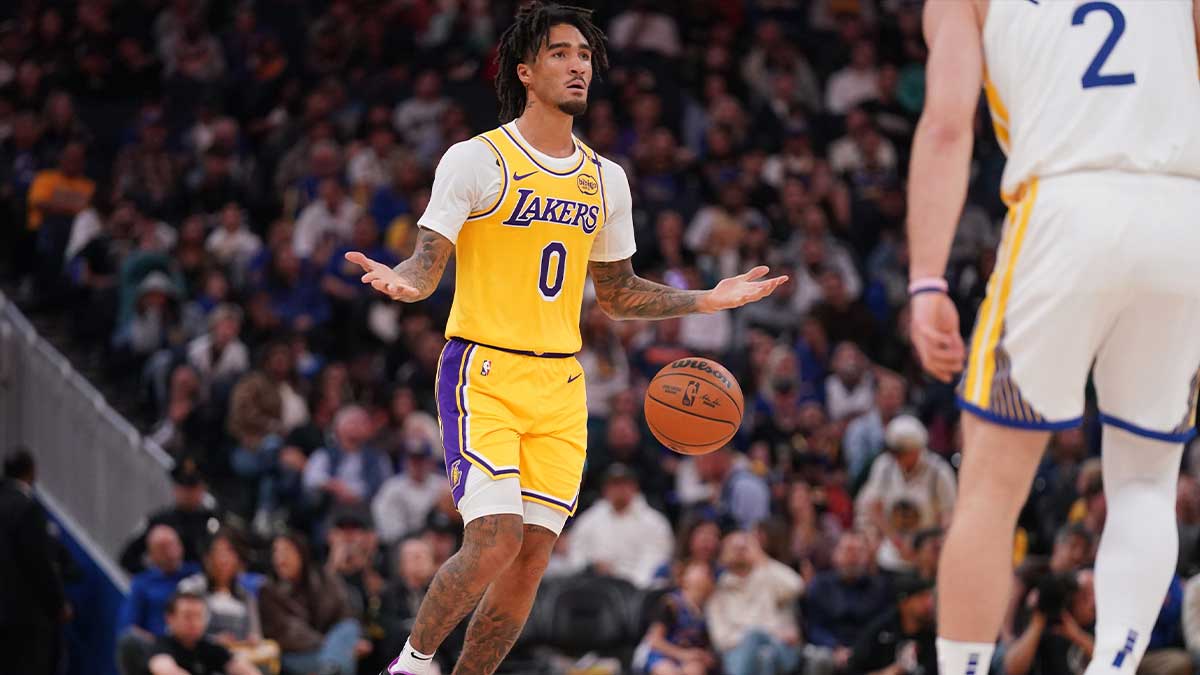 Los Angeles Lakers guard Jalen Hood-Schifino (0) dribbles the ball up the court against the Golden State Warriors in the first quarter at the Chase Center. 