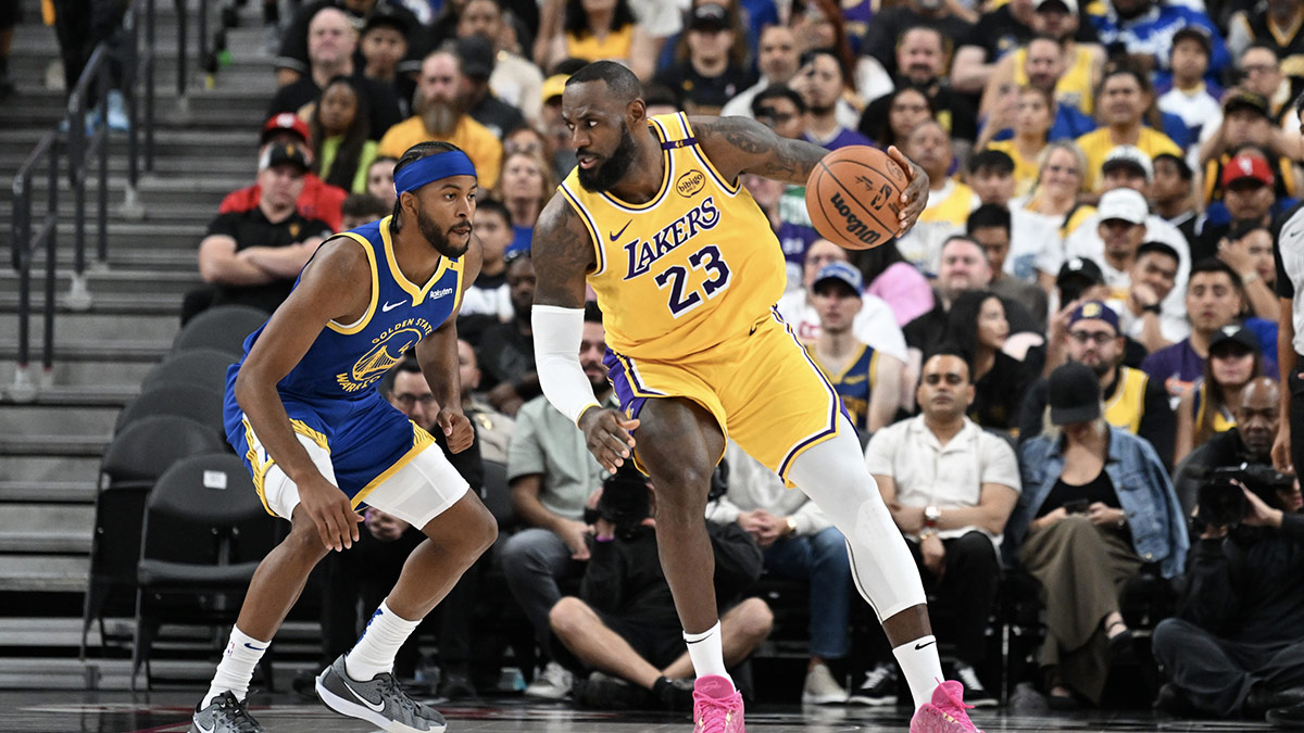 Golden State Warriors guard Moses Moody (4) defends against Los Angeles Lakers forward LeBron James (23) in the second quarter at T-Mobile Arena. 