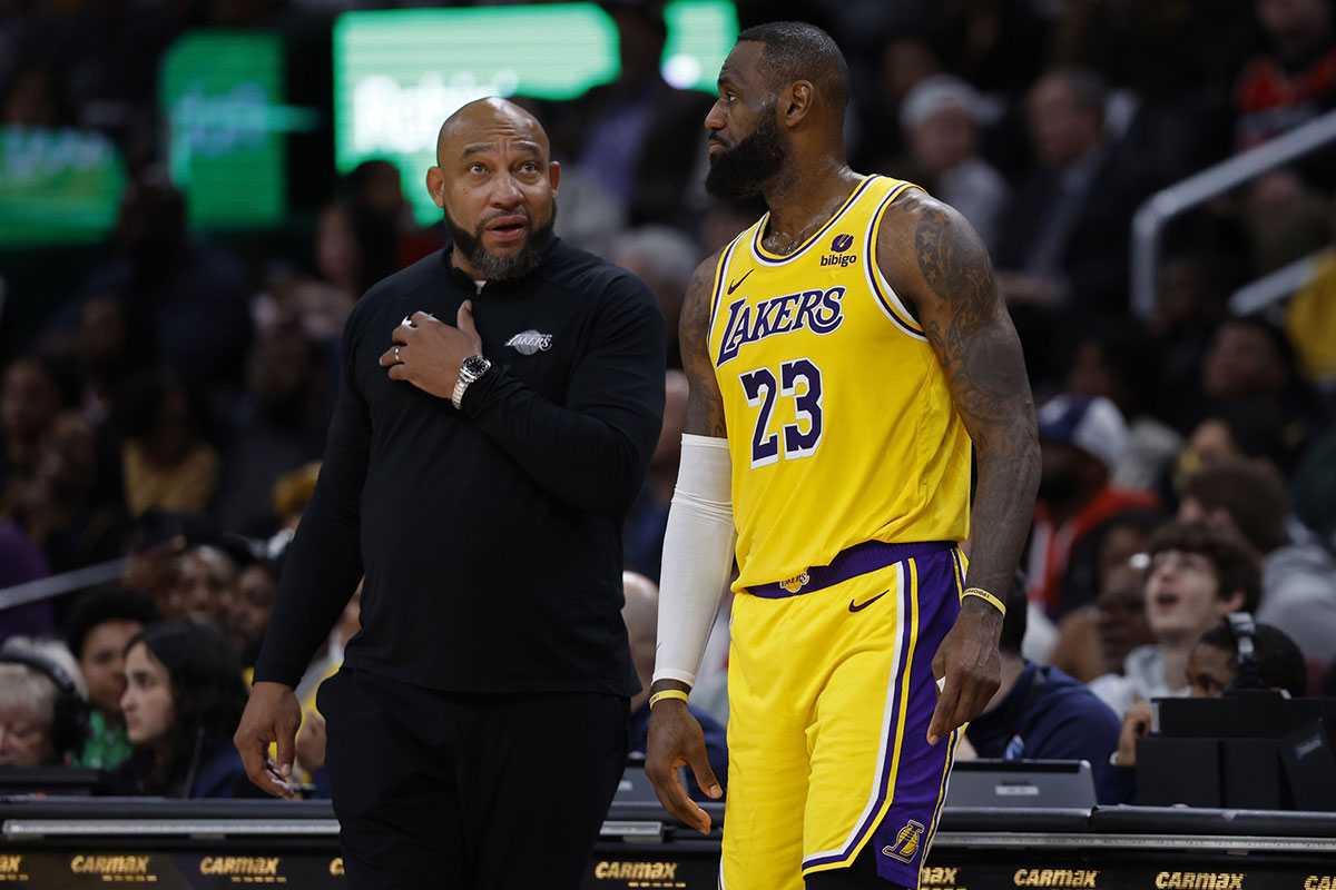 Los Angeles Lakers forward LeBron James (23) talks with Lakers head coach Darvin Ham (L) against the Washington Wizards at Capital One Arena.