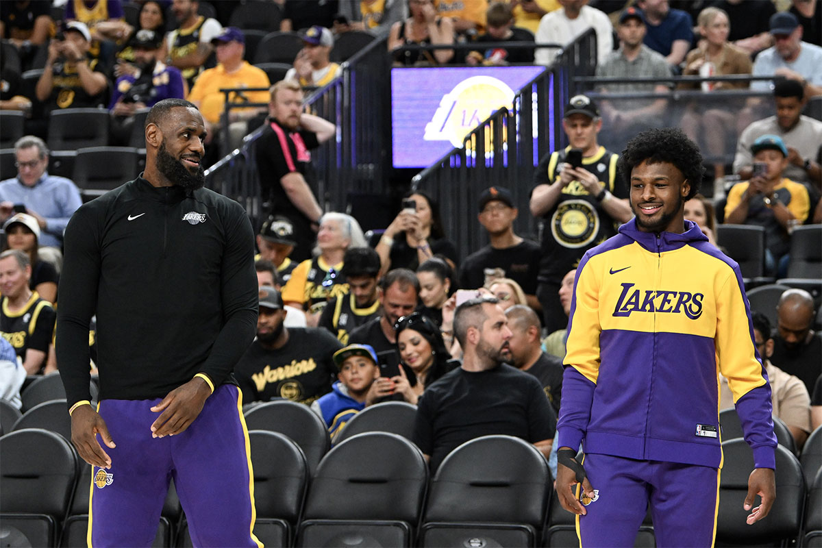  Los Angeles Lakers forward LeBron James (23) warms up with guard Bronny James (9) before the preseason game against the Golden State Warriors at T-Mobile Arena. 