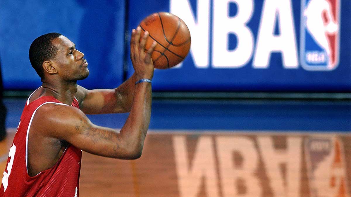 As a Cavaliers rookie, LeBron James takes a foul shot during a summer league game against Atlanta on July 18, 2003, in Boston.