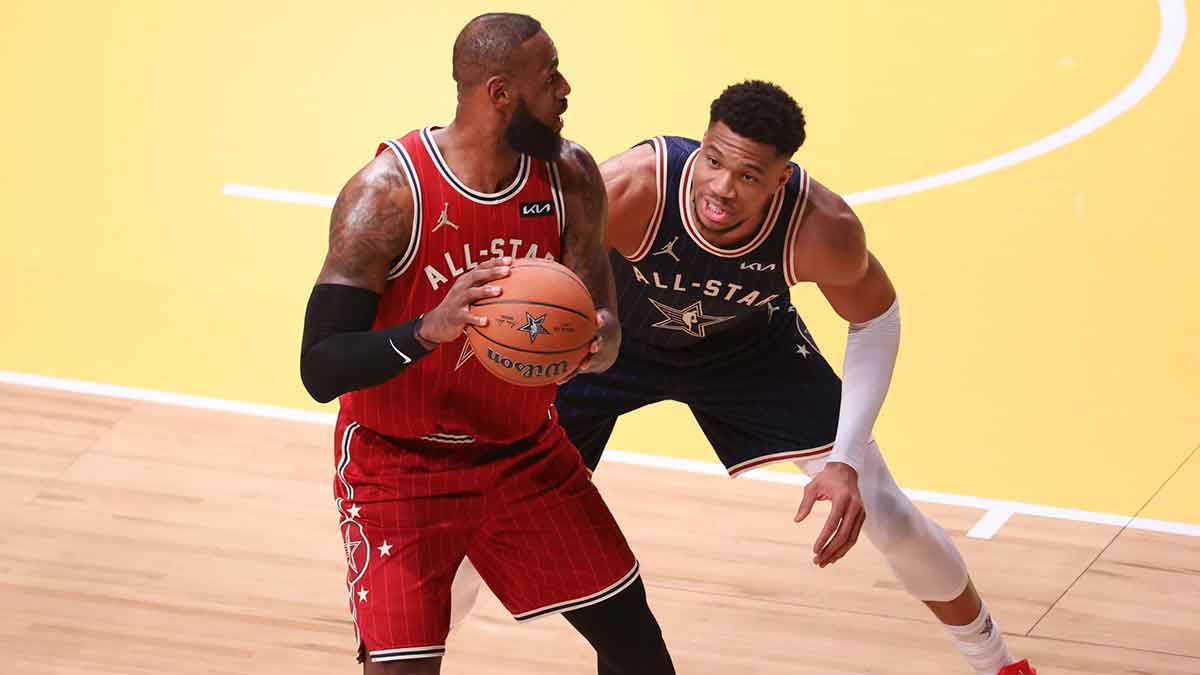 Eastern Conference forward Giannis Antetokounmpo (34) of the Milwaukee Bucks defends Western Conference forward LeBron James (23) of the Los Angeles Lakers during the first quarter in the 73rd NBA All Star game at Gainbridge Fieldhouse.