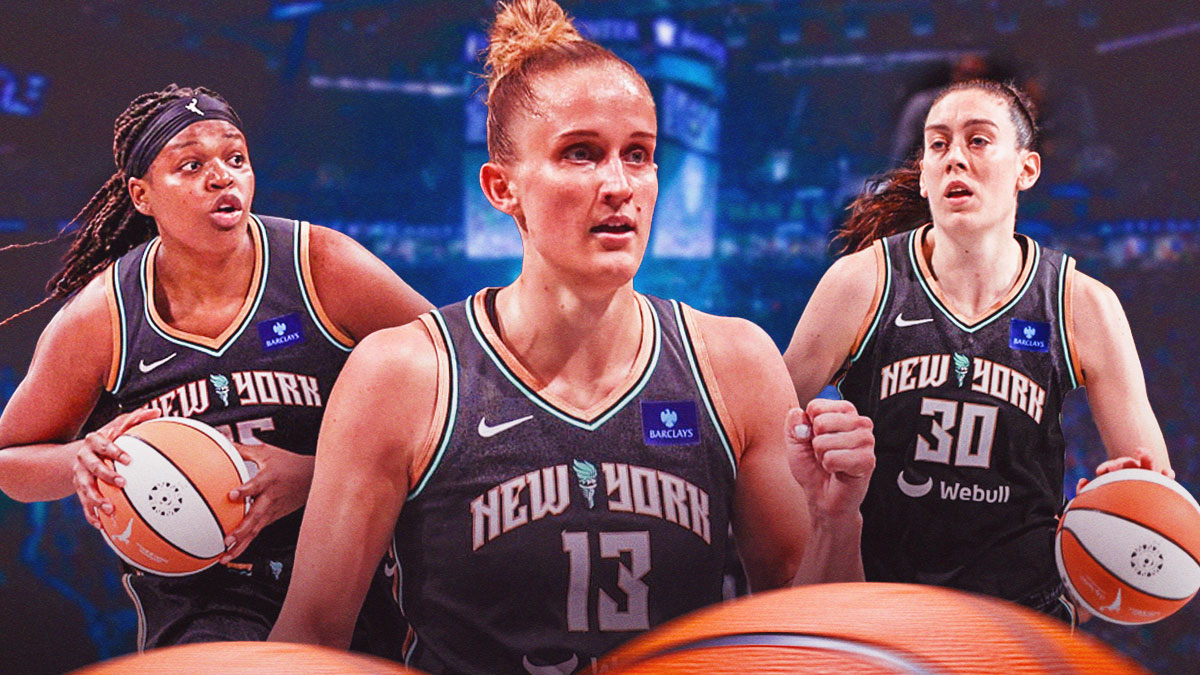 Leonie Fiebich (Liberty) celebrating championship. Teammates Jonquel Jones and Breanna Stewart in background at Barclays Center