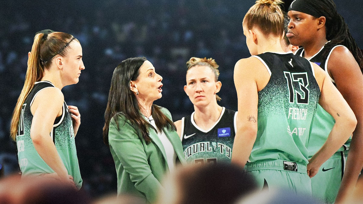 Sandy Brondello (Liberty coach) coaching her team in huddle, Liberty players around her
