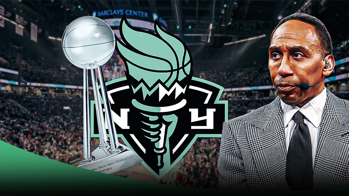an ecstatic Stephen A. Smith looking at the New York Liberty logo with the WNBA Championship trophy