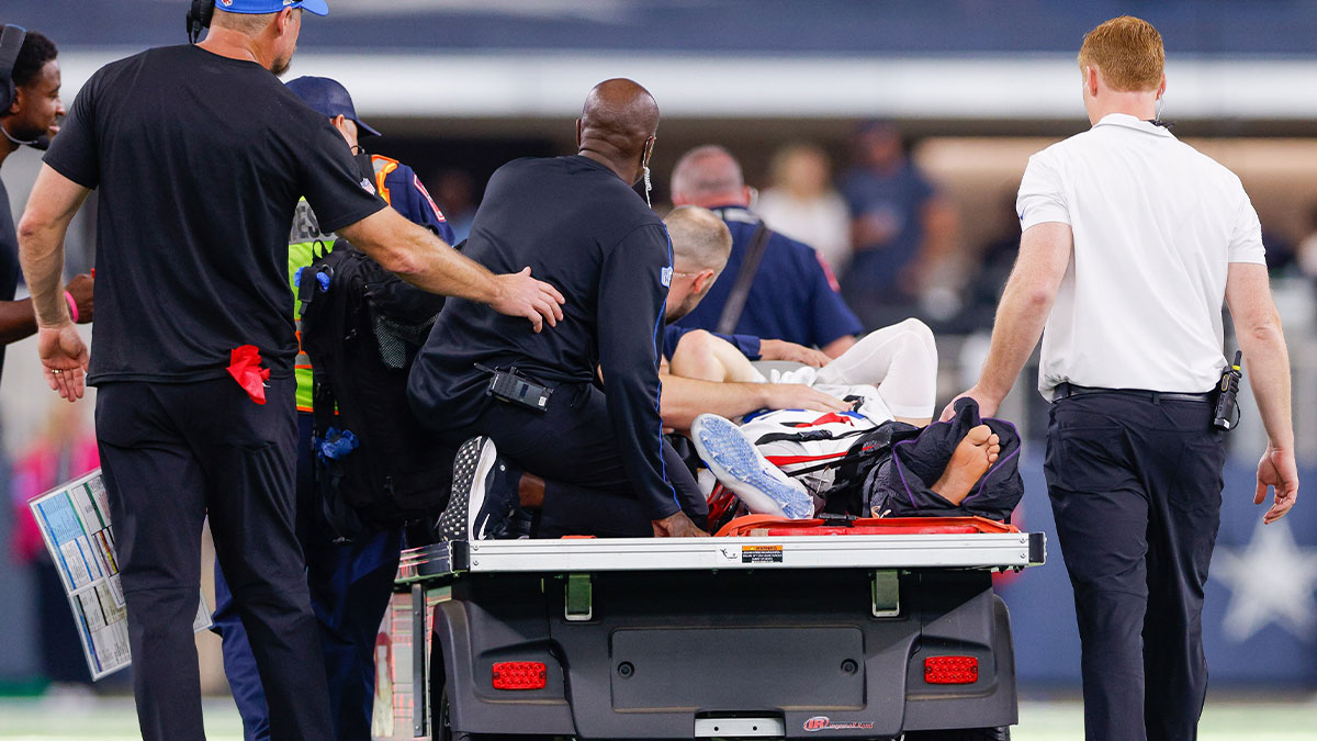 Detroit Lions defensive end Aidan Hutchinson (97) is carted off the field during the third quarter after being injured against the Dallas Cowboys at AT&T Stadium