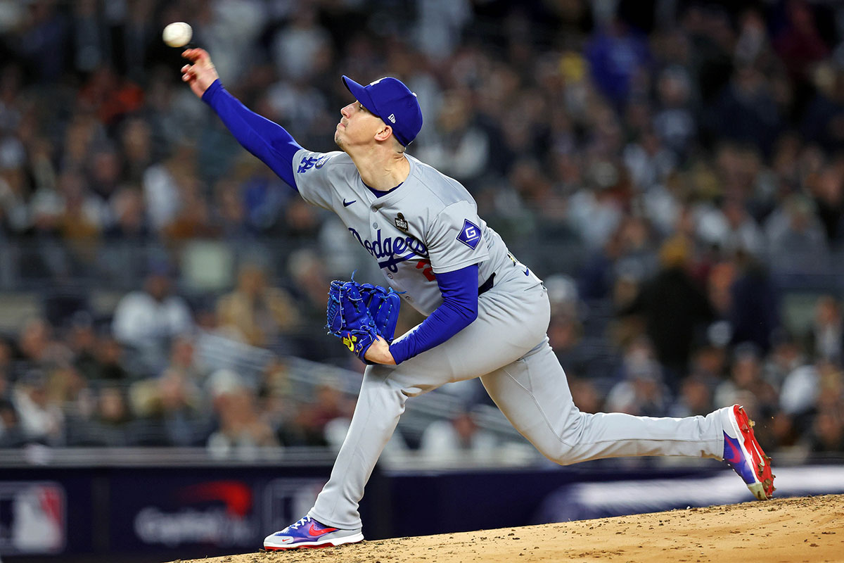 Los Angeles Dodgers pitcher Walker Buehler (21) pitches during the first inning against the New York Yankees. 
