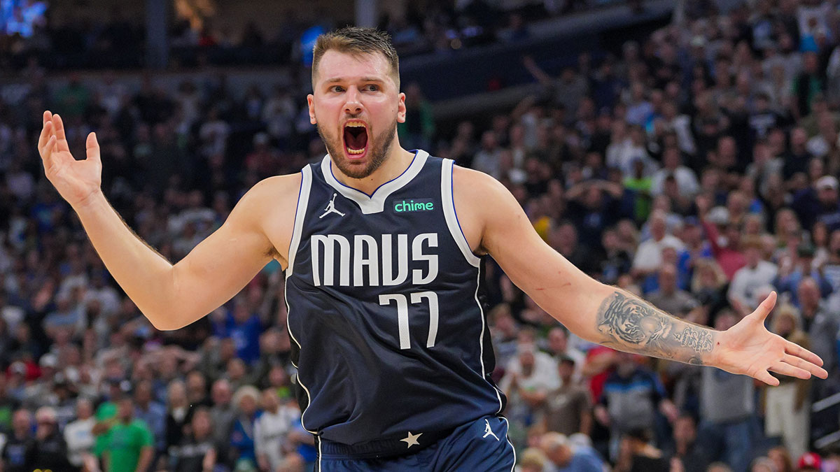 Mavericks guard Luka Doncic (77) reacts to a call against the Minnesota Timberwolves in the fourth quarter at Target Center